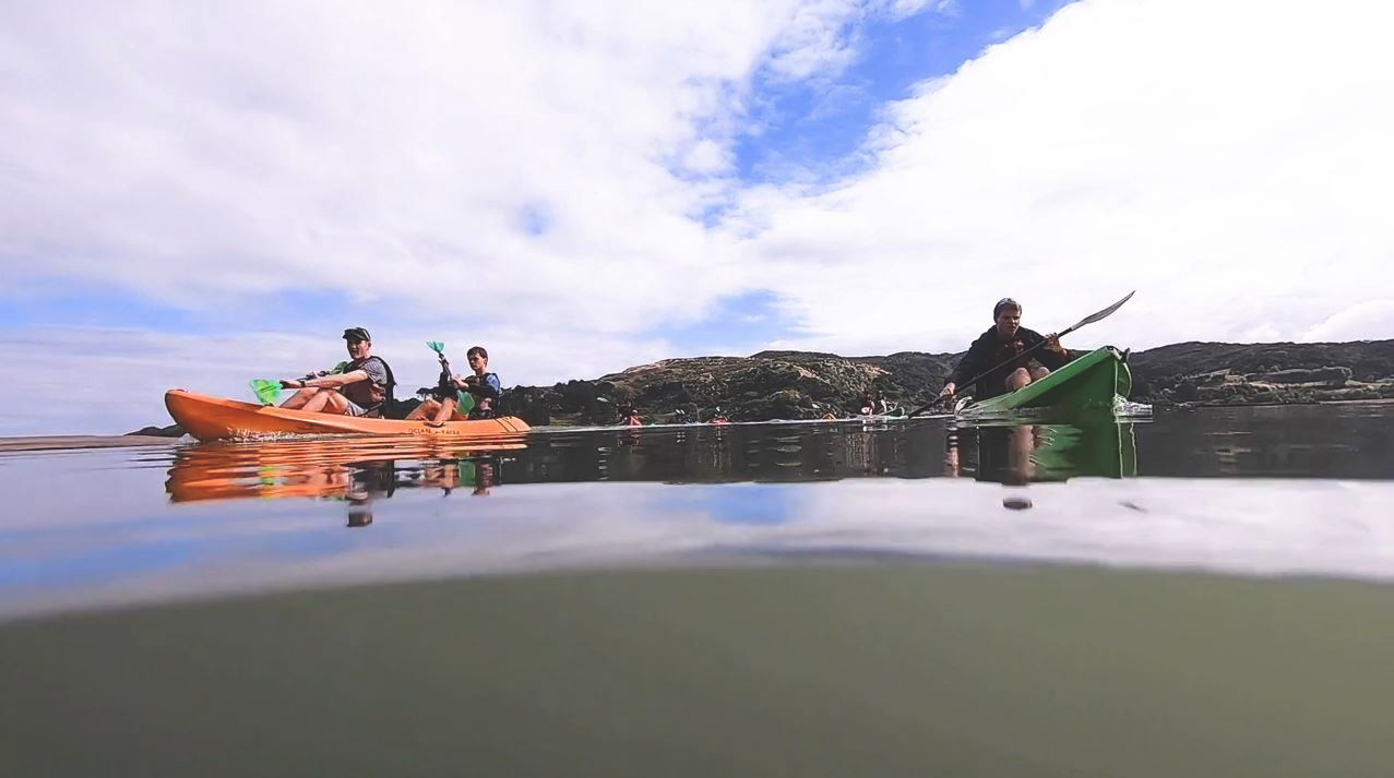 people in kayaks