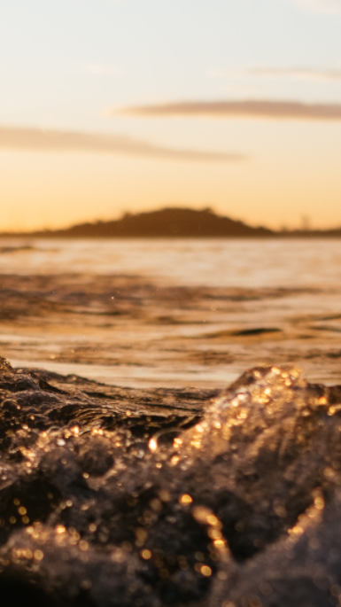 sunrise over ocean water