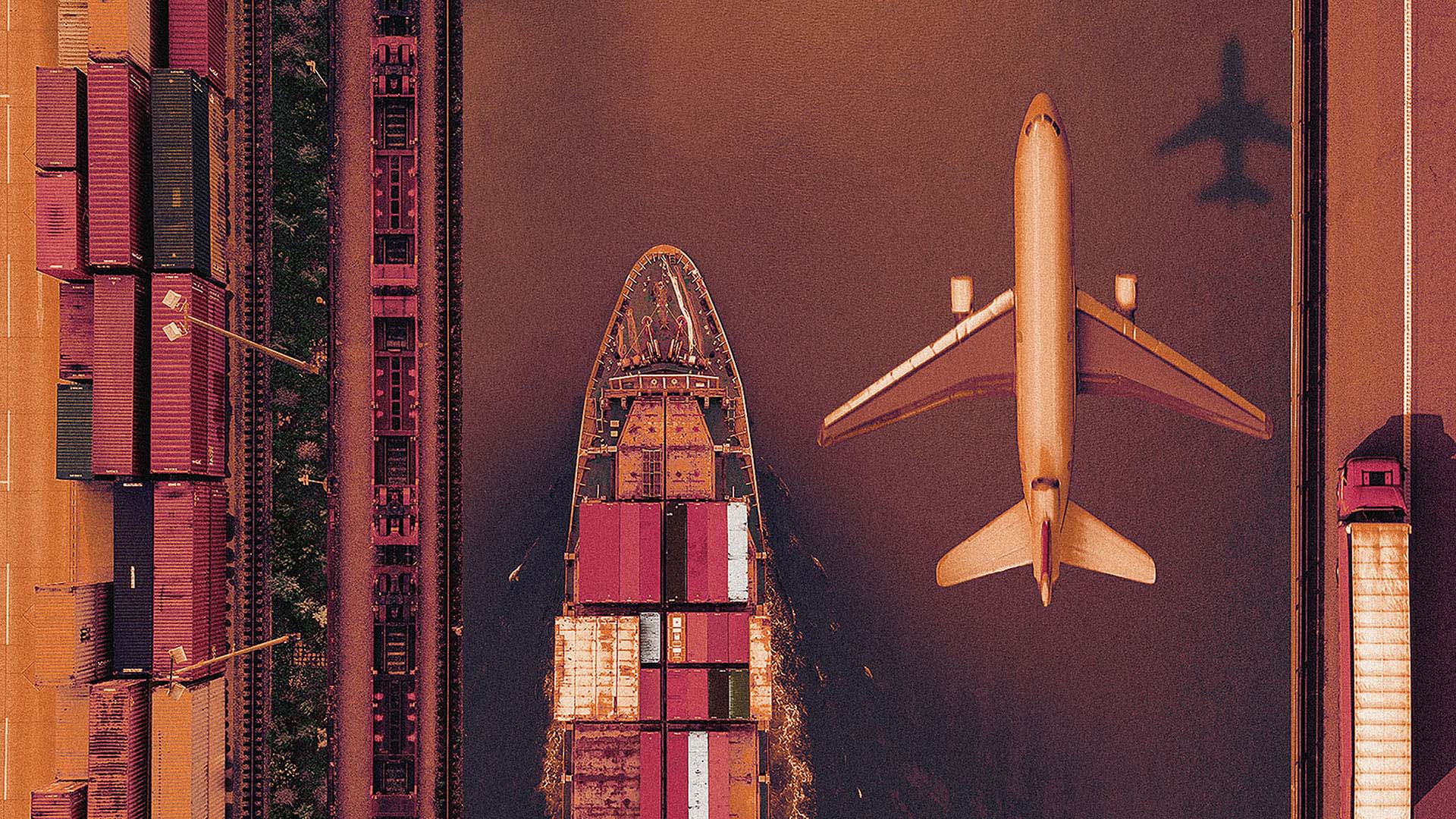 plane flying over cargo ship