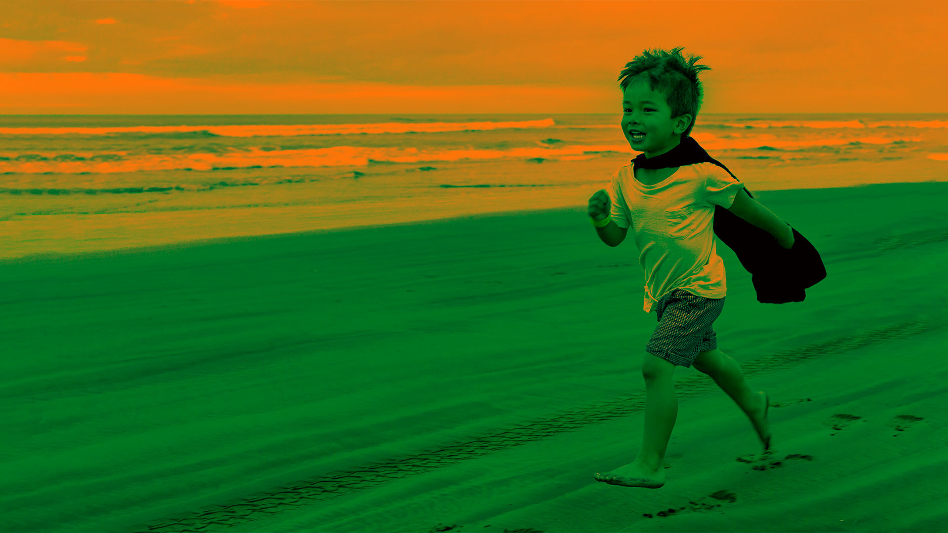 boy running on beach