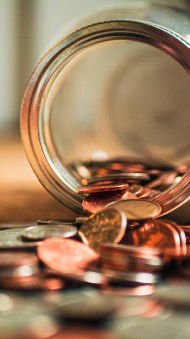coins tipped out of a jar