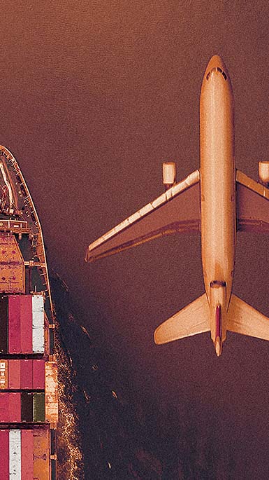 plane flying over cargo ship