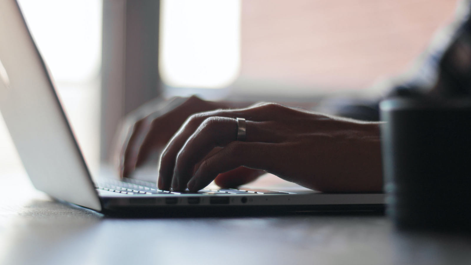 typing on laptop 