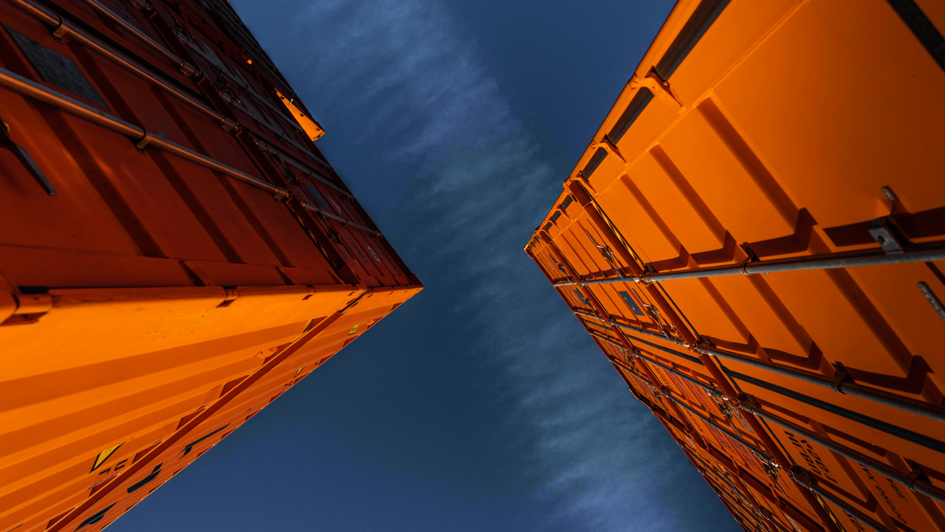 two large orange shipping containers 