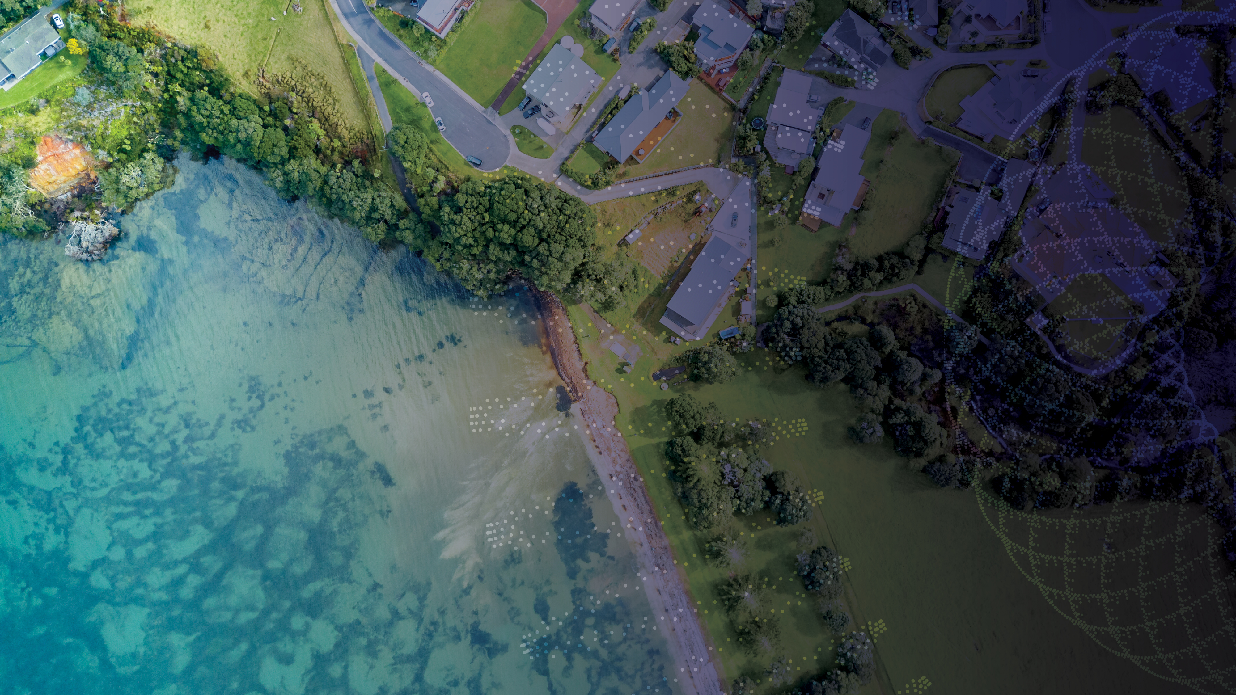 aerial shot of houses and water 