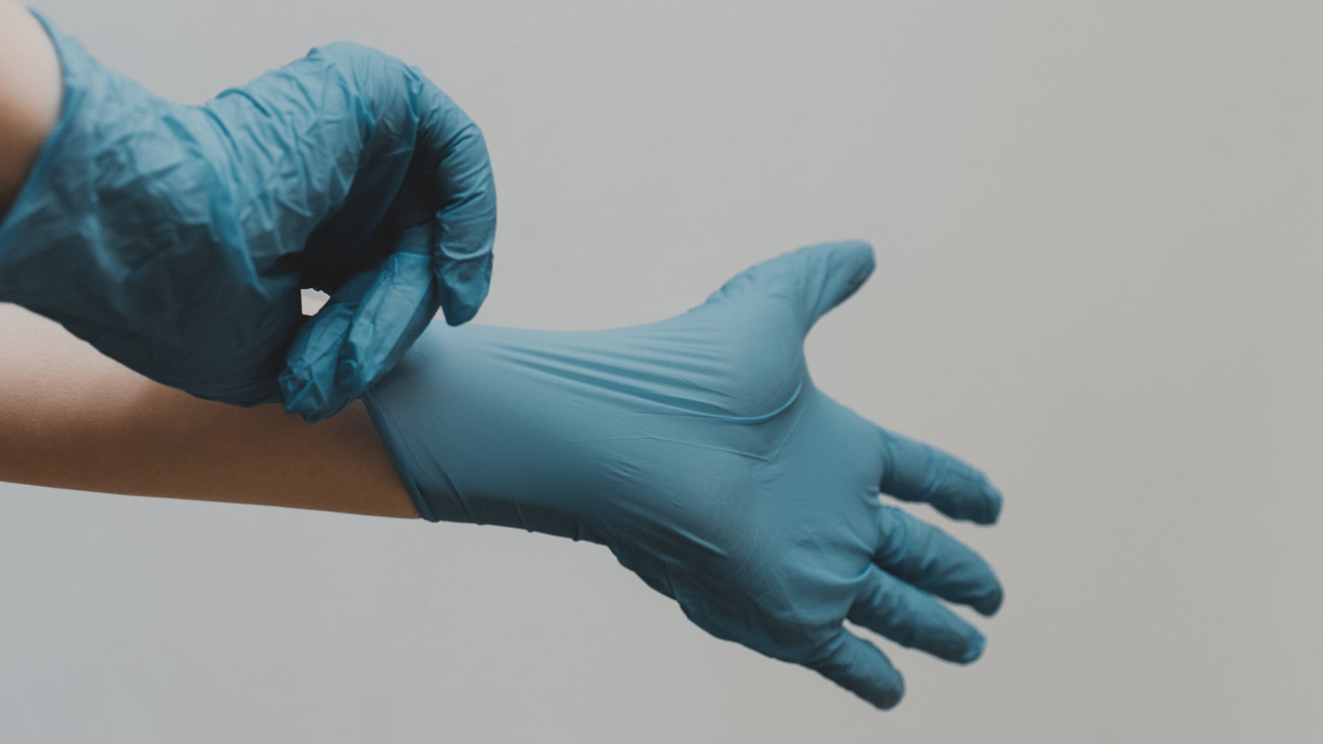 medical gloves being put on